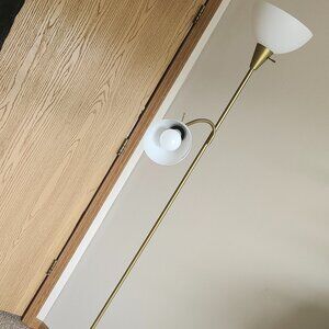Tall gold standing light fixture.